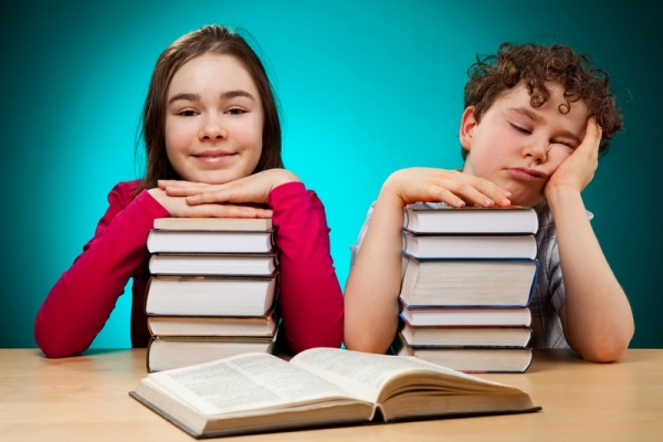 Young girl and boy learning at home