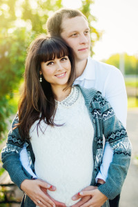 Man and Pregnant Woman in sunlight