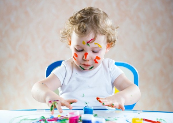 Cute little child painting